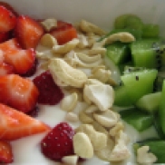 Yogurt with fruit and nuts.